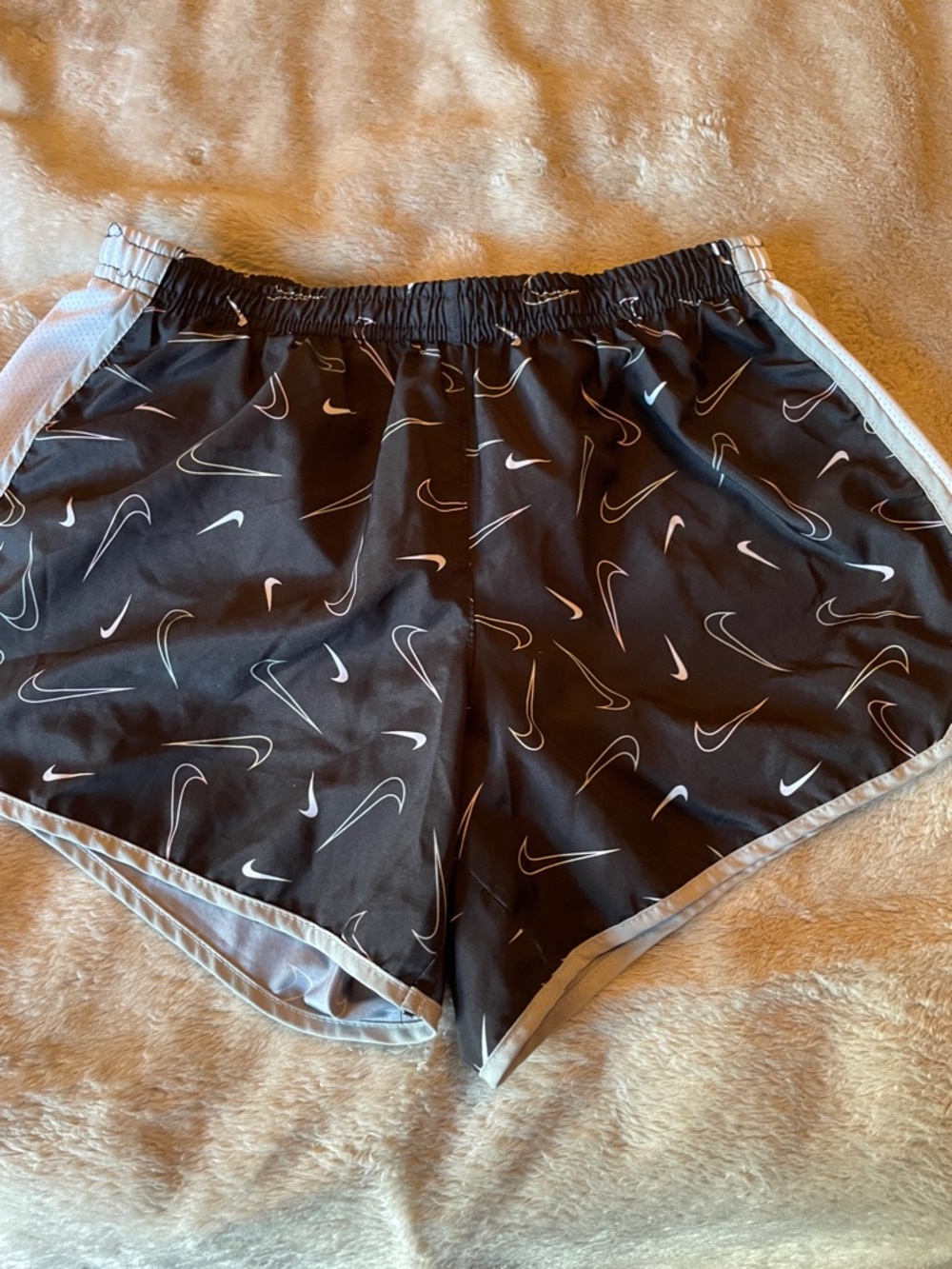 Girls Nike Black Athletic Shorts with White Swoosh Print